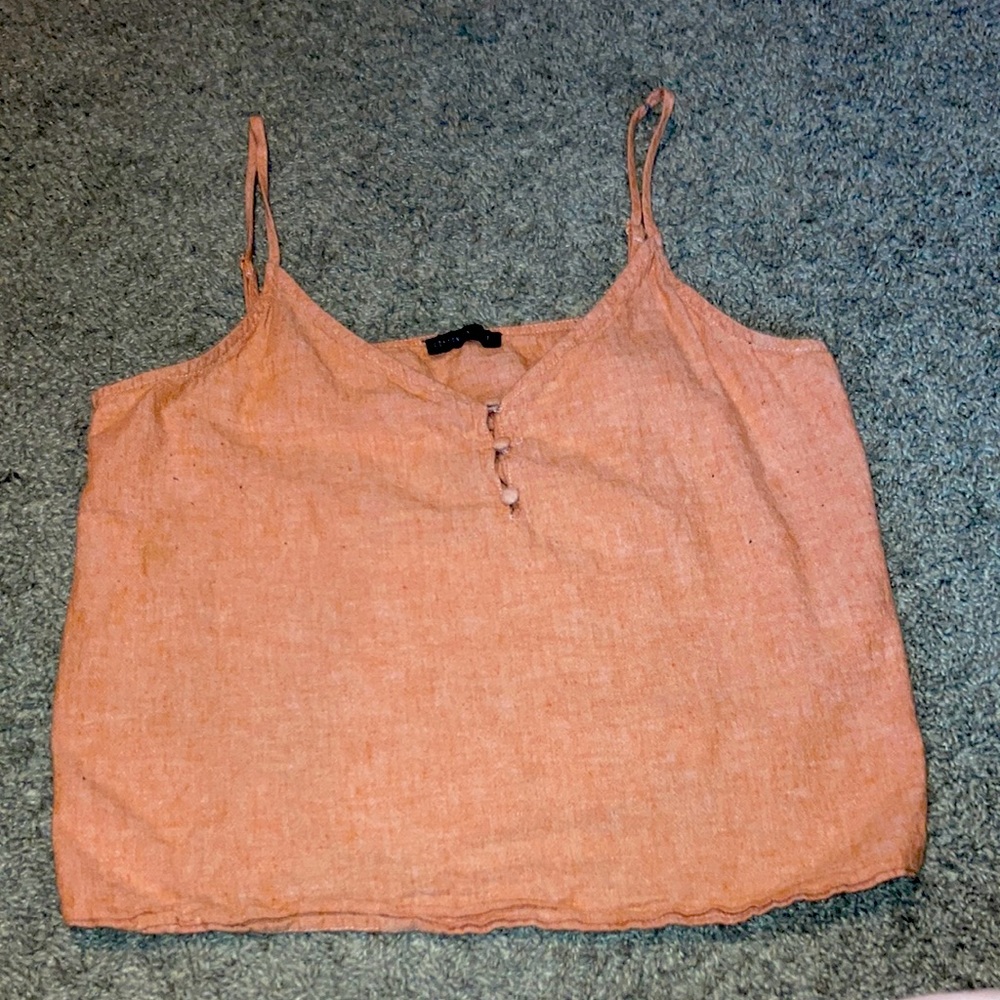 Coral colored crop tank with 3 buttons in front
